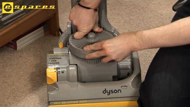 Click the lid back into place over the post-motor filter