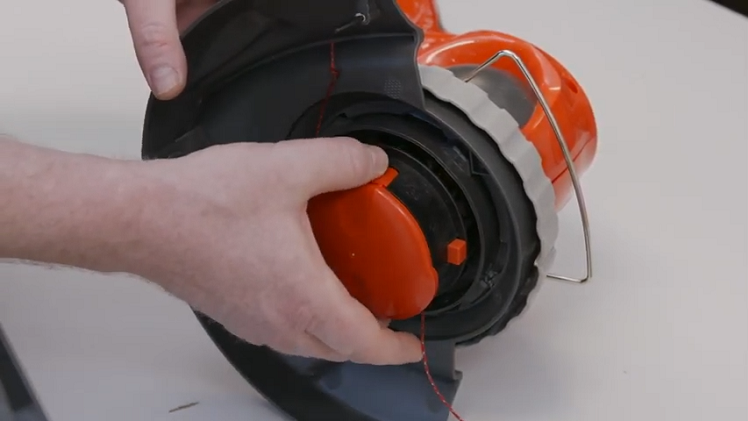 How to Replace the Spool Cover on a Flymo Trimmer