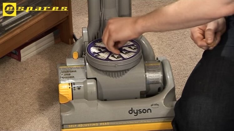 Remove the old post-motor filter and place the new one in its place