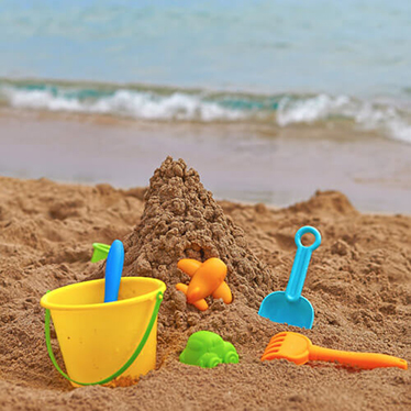 Bucket and spade on beach