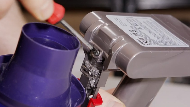 Undo the screw at the front near the cyclone and lift the battery out