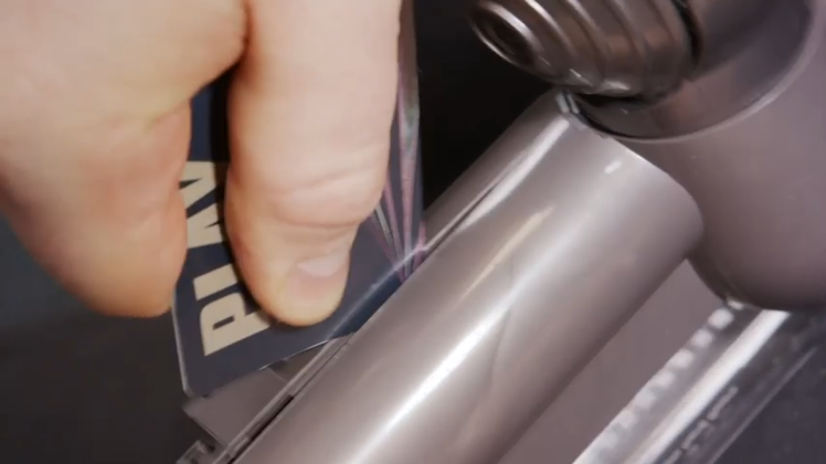 When you have placed the card in between the upper and lower housing, just slide it along and the catch should separate