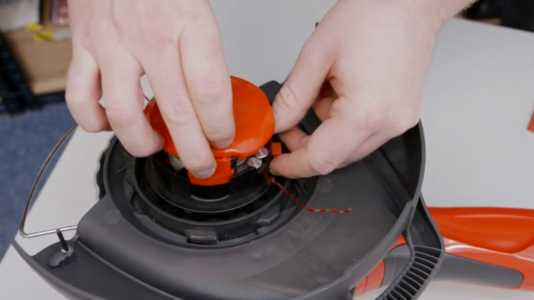 How to Replace the Manual Line Feeder on a Flymo Grass Trimmer