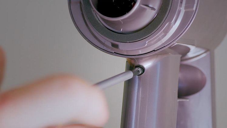 Secure the battery on the motor handle by attaching the single screw that has a washer.