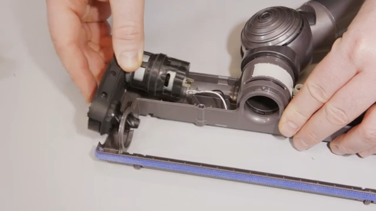 Slot your new drive assembly in place of the old one, then refit the electrical connections and refit the plastic cover