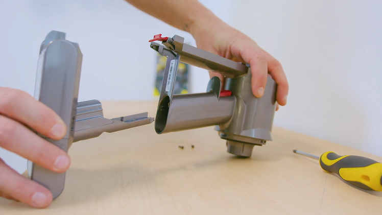 With the screws removed, you'll be able to remove the battery by sliding it out.