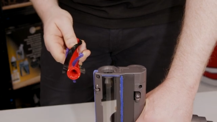 Place the brushbar inside with the drive assembly end first and push it all the way down
