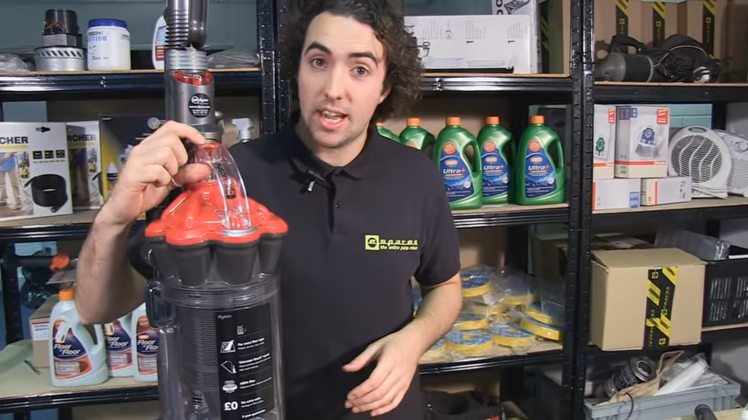 Press the canister release button and remove it